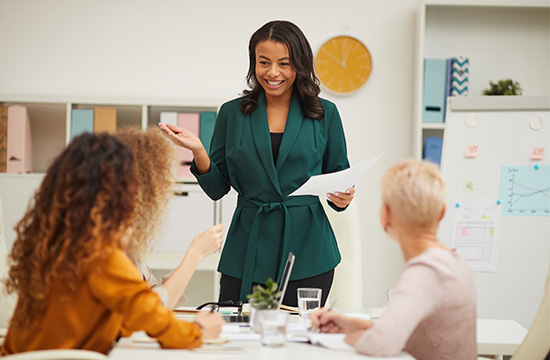 cheerful african-american woman making report